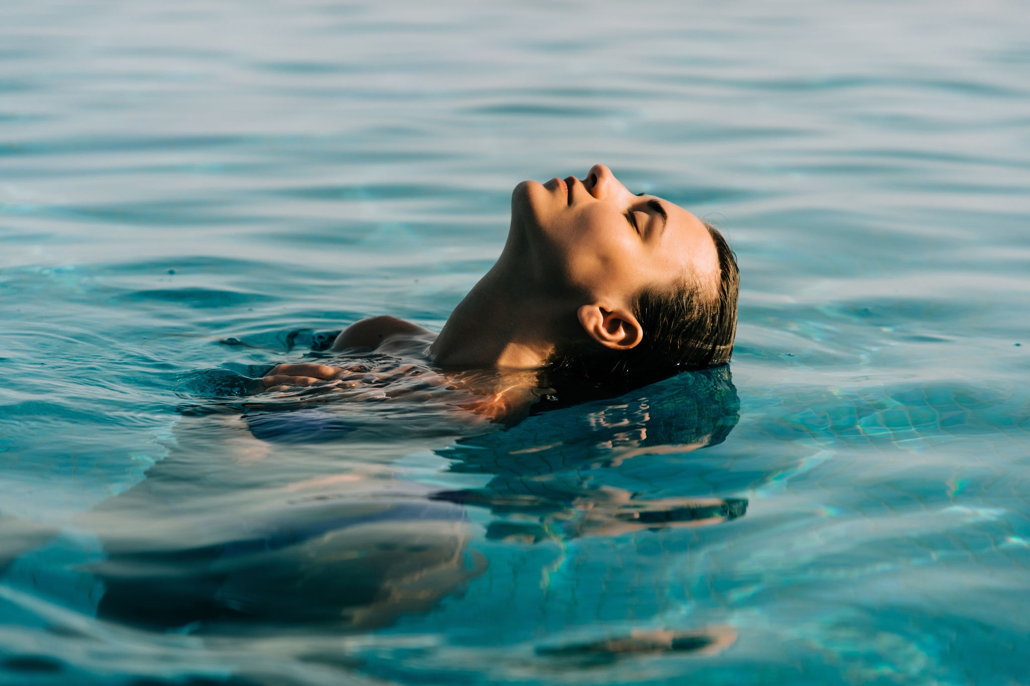 Young woman in the swimming pool