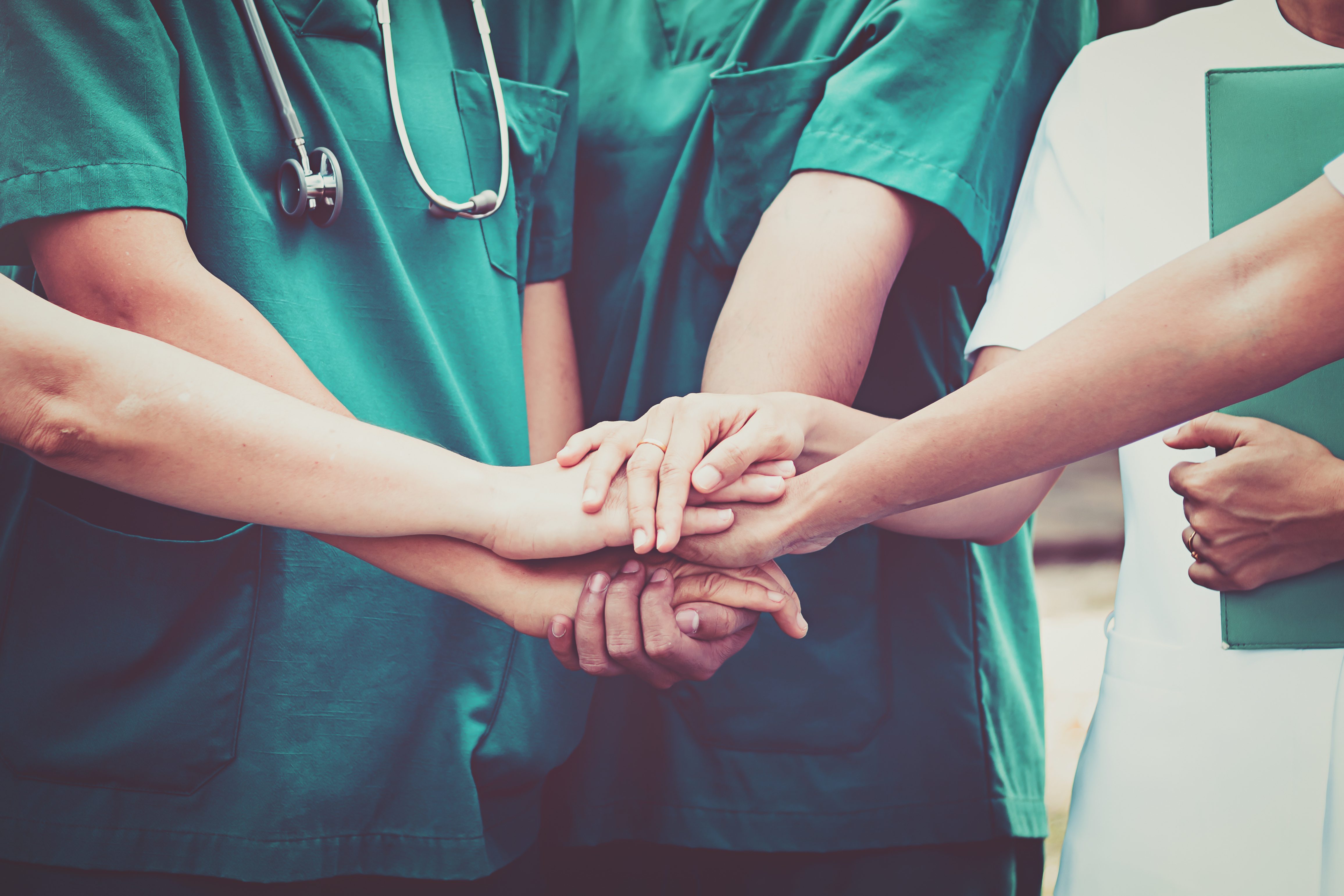 Doctors and nurses coordinate hands. Concept Teamwork